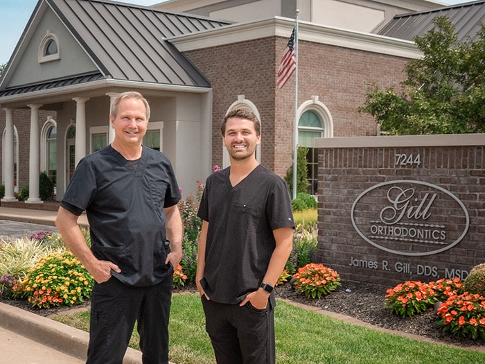 Doctors in front of office building at Gill Wedding Orthodontics in Evansville, IN